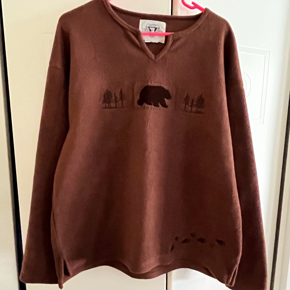 Women’s fleece top with bear and paw prints on it